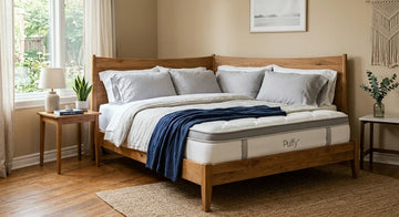 Puffy Lux mattress displayed on a bed frame.